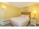 Bright bedroom featuring a comfortable bed, bedside table, and climate control for a pleasant stay at 2301 S Ocean Blvd. # 130, Myrtle Beach, SC 29577