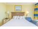 Comfortable hotel bedroom with a plush bed, soft lighting, and a cozy armchair at 2301 S Ocean Blvd. # 130, Myrtle Beach, SC 29577