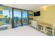 Bright hotel room featuring a bed, balcony, and partial view of the resort swimming pool and ocean at 2301 S Ocean Blvd. # 130, Myrtle Beach, SC 29577