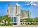 Stunning condo building with unique architecture and lush landscaping providing ocean views and parking at 2301 S Ocean Blvd. # 130, Myrtle Beach, SC 29577