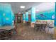 Comfortable outdoor dining area with ocean-themed decor in a shaded space at 2301 S Ocean Blvd. # 130, Myrtle Beach, SC 29577