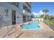 Serene outdoor pool area surrounded by greenery and lounge chairs, designed for relaxation at 2301 S Ocean Blvd. # 130, Myrtle Beach, SC 29577
