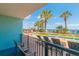 Scenic balcony view overlooking the pool and beach, with lounge chairs and tropical palm trees at 2301 S Ocean Blvd. # 130, Myrtle Beach, SC 29577