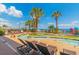 Lazy river pool surrounded by palm trees, umbrellas, and resort seating with beach views at 2301 S Ocean Blvd. # 130, Myrtle Beach, SC 29577