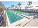 Outdoor shuffleboard courts provide entertainment in a resort-style setting with palm trees and sunny skies at 2301 S Ocean Blvd. # 130, Myrtle Beach, SC 29577