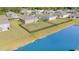Aerial view of a fenced backyard bordering a pond, enhancing the home's outdoor appeal at 231 Jeff Waters Circle, Longs, SC 29568