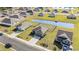 Neighborhood aerial showcasing single-story homes near pond and green spaces, offering a serene community at 231 Jeff Waters Circle, Longs, SC 29568
