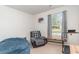 Bedroom with a reading area featuring a cozy chair, a window with a view, and an exercise machine at 231 Jeff Waters Circle, Longs, SC 29568