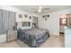 Cozy bedroom showcasing a decorative headboard, and access to the bathroom with vanity at 231 Jeff Waters Circle, Longs, SC 29568