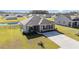 Well-kept single-story home with landscaped front yard, set in a neighborhood near a pond at 231 Jeff Waters Circle, Longs, SC 29568