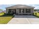 Attractive one-story home featuring neutral siding, well-maintained landscaping, and a driveway at 231 Jeff Waters Circle, Longs, SC 29568