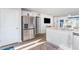 Bright kitchen with white cabinets, stainless steel refrigerator, and an undermount sink at 231 Jeff Waters Circle, Longs, SC 29568