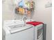 Laundry room featuring a white washer and dryer with wire shelving for storage at 231 Jeff Waters Circle, Longs, SC 29568