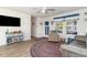 Cozy living room with hardwood floors, bright windows, and a comfortable sitting area at 231 Jeff Waters Circle, Longs, SC 29568