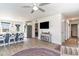 Open-concept living area featuring a kitchen island and hardwood floors at 231 Jeff Waters Circle, Longs, SC 29568