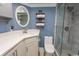 Updated bathroom featuring granite countertop, framed oval mirror, and walk-in shower with glass enclosure at 2406 N Ocean Blvd. # 803, Myrtle Beach, SC 29577