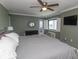 Relaxing bedroom features a ceiling fan, balcony access, and tiled floors at 2406 N Ocean Blvd. # 803, Myrtle Beach, SC 29577