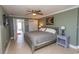 Inviting bedroom showcases stylish decor, tile flooring, and access to a balcony at 2406 N Ocean Blvd. # 803, Myrtle Beach, SC 29577