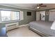 Comfortable bedroom featuring tile flooring, a large window, and a ceiling fan at 2406 N Ocean Blvd. # 803, Myrtle Beach, SC 29577