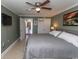 Well-lit bedroom boasts tiled flooring, a ceiling fan and ensuite kitchen access at 2406 N Ocean Blvd. # 803, Myrtle Beach, SC 29577