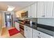 Well-equipped kitchen featuring stainless steel appliances and a sleek black countertop at 2406 N Ocean Blvd. # 803, Myrtle Beach, SC 29577