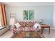 Bright living room featuring tropical decor, a ceiling fan, and tile floors, creating a relaxing atmosphere at 2406 N Ocean Blvd. # 803, Myrtle Beach, SC 29577
