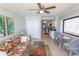 Spacious living room boasting tropical decor, tile flooring, and an open layout for easy entertaining at 2406 N Ocean Blvd. # 803, Myrtle Beach, SC 29577