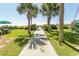 A scenic walkway leads to the beach, lined with lush landscaping and palm trees at 2406 N Ocean Blvd. # 803, Myrtle Beach, SC 29577