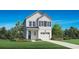 Charming two-story home with white siding, black shutters, and well-manicured lawn and garden beds at 2440 Hillbourne Loop, North Myrtle Beach, SC 29582