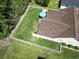 Aerial view of a home's backyard with a white fence and patio with an umbrella at 255 Tibton Circle, Myrtle Beach, SC 29588