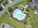 Aerial view of a community pool with lounge chairs, tables, and a nearby pool house at 255 Tibton Circle, Myrtle Beach, SC 29588