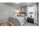 A simple bedroom setup with one window and a small bedside table at 269 Mayflower Dr., Calabash, NC 28467