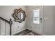Bright foyer with hardwood floors, ornate mirror, and frosted glass front door at 269 Mayflower Dr., Calabash, NC 28467