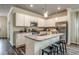 Open kitchen featuring white cabinetry, granite countertops, stainless steel appliances, and a center island with seating at 269 Mayflower Dr., Calabash, NC 28467