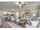 Open-concept living room with hardwood floors, kitchen view, and comfortable seating at 269 Mayflower Dr., Calabash, NC 28467