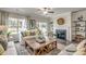 Bright living room features a fireplace, hardwood floors, and access to the backyard at 269 Mayflower Dr., Calabash, NC 28467