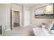 Relaxing bedroom with neutral tones, plush carpeting, and an inviting chair, illuminated by natural light at 2884 Riverboat Way, Conway, SC 29526