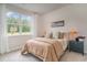 Inviting bedroom filled with natural light from a large window, creating a warm atmosphere at 2884 Riverboat Way, Conway, SC 29526