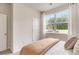 Comfortable bedroom with a large window, soft carpet, and a door leading to the hallway at 2884 Riverboat Way, Conway, SC 29526