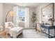 Cozy bedroom featuring a comfortable chair, desk, and natural light streaming through the large window at 2884 Riverboat Way, Conway, SC 29526