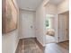 Bright foyer with wood floors and a decorative rug that leads into the bedroom and other living spaces at 2884 Riverboat Way, Conway, SC 29526