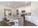 Kitchen island with barstool seating, stainless steel appliances, and granite countertops for stylish dining at 2884 Riverboat Way, Conway, SC 29526