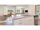 Open-concept kitchen with granite countertops and stainless steel appliances flowing into the dining and living area at 2884 Riverboat Way, Conway, SC 29526