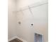 Practical laundry room with white wire shelving for optimal storage solutions, painted in a neutral shade at 2884 Riverboat Way, Conway, SC 29526