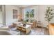 Bright and airy living room featuring a cozy sofa, a large window, and modern decor accents for a serene atmosphere at 2884 Riverboat Way, Conway, SC 29526