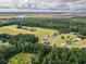 Aerial view of a community surrounded by lush green forests and waterways at 294 Field Loop Rd., Georgetown, SC 29440