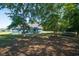 This spacious backyard is partially shaded and features a trampoline at 294 Field Loop Rd., Georgetown, SC 29440