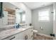 Bathroom featuring a granite counter, white cabinets, and modern fixtures at 294 Field Loop Rd., Georgetown, SC 29440