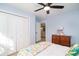 Bedroom with a ceiling fan, closet, and dresser with stylish decor at 294 Field Loop Rd., Georgetown, SC 29440