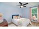 Bright bedroom with a ceiling fan, window, and decorated with stylish decor at 294 Field Loop Rd., Georgetown, SC 29440